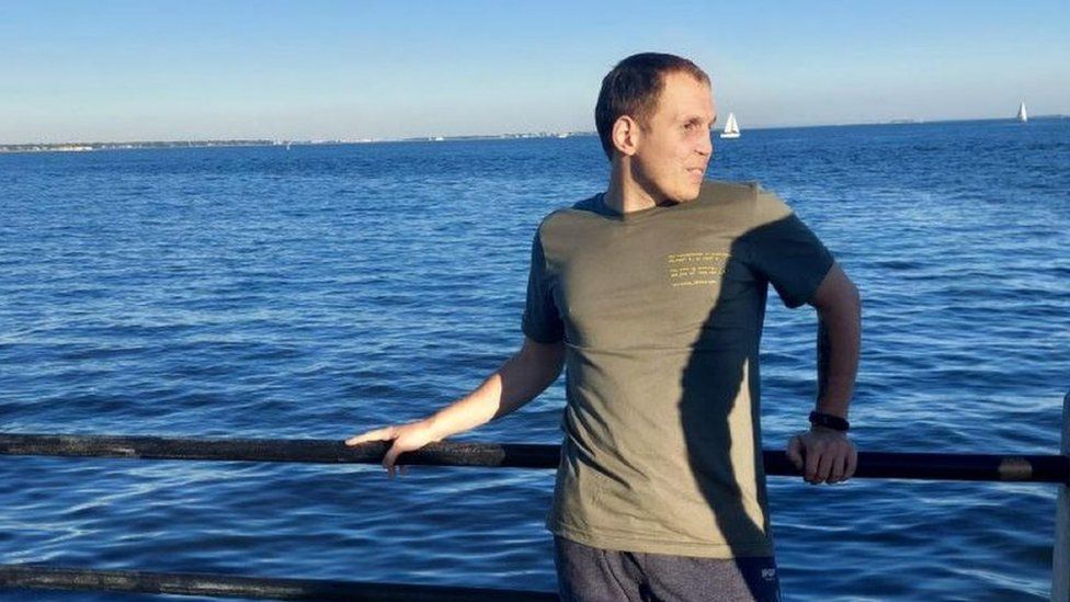 Serhiy in front of water